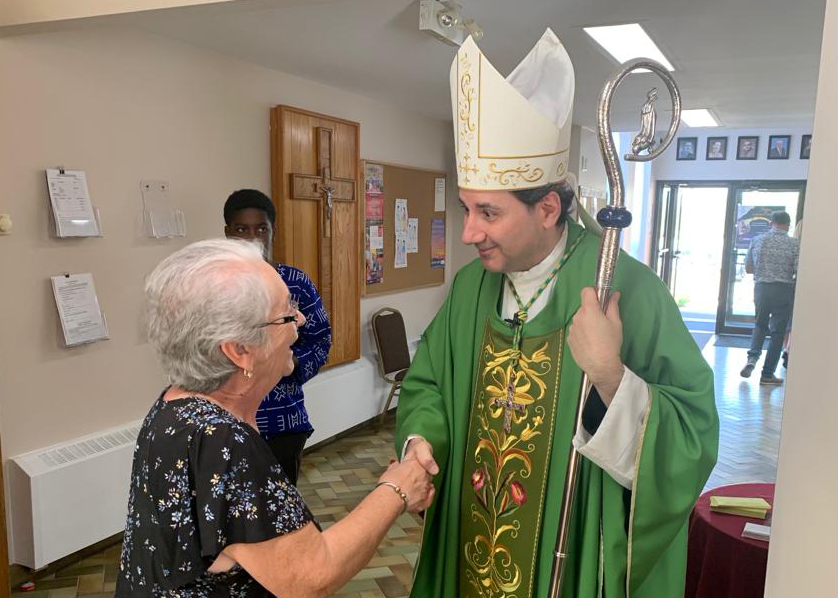 Archbishop Leo greats the faithful