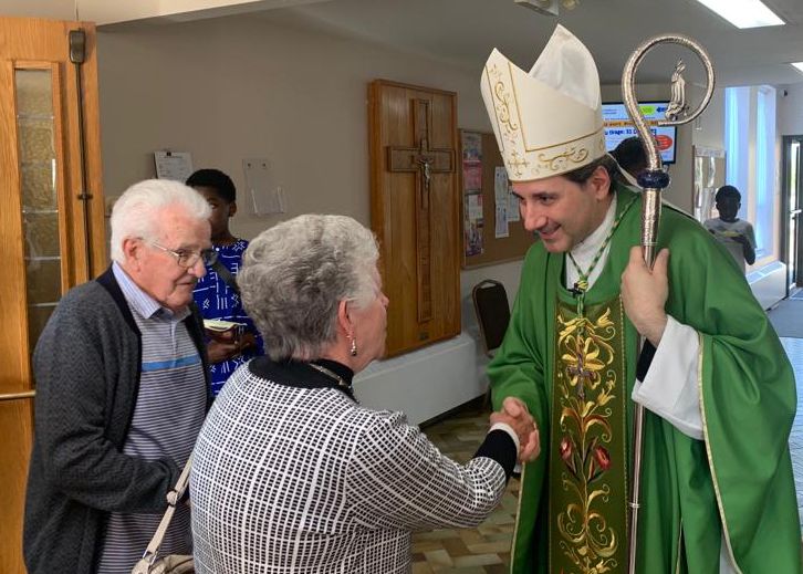 Archbishop Leo greats the faithful