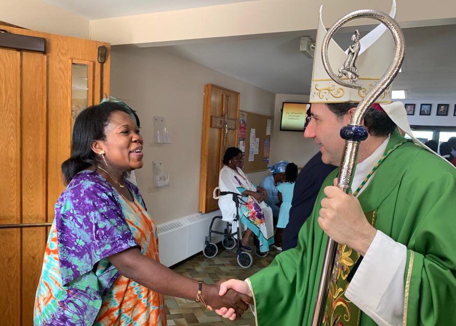 Archbishop Leo greats the faithful