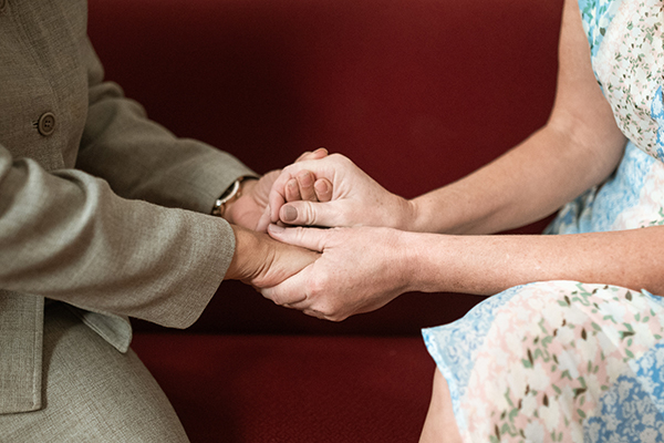 Two people holding hands